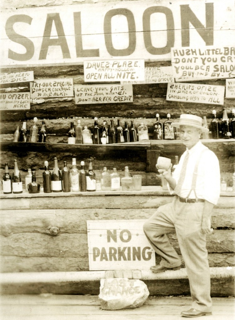 A fake saloon set up for tourists on thier way to Canada in the 1920s. Visitors would pose for photos to make them look like they were 'Scofflaws'...