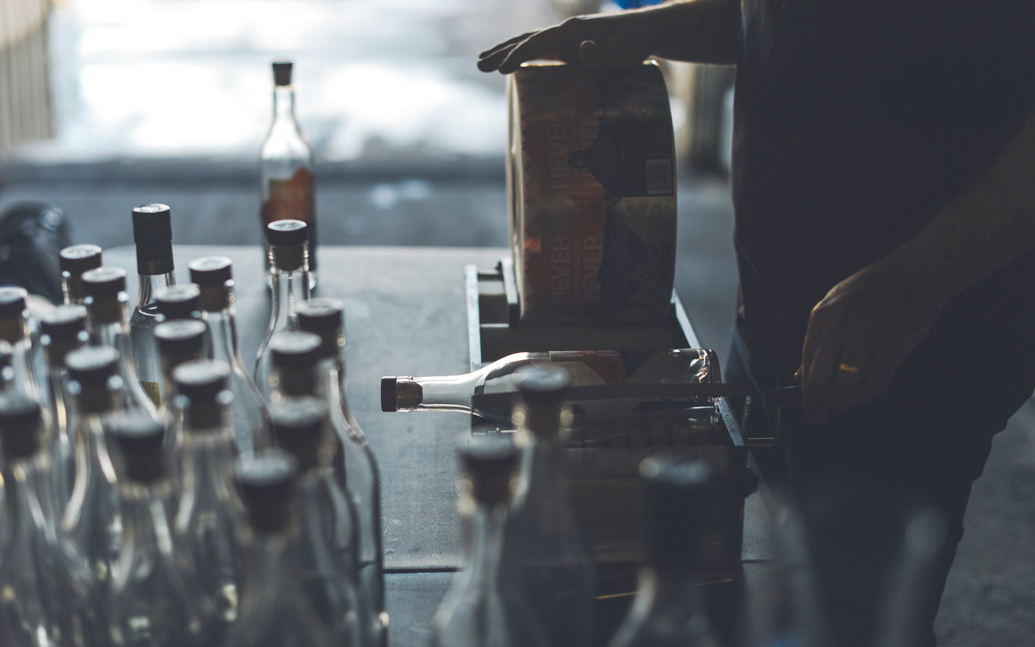 Never Never Distilling Co.'s bottles are labelled by hand.